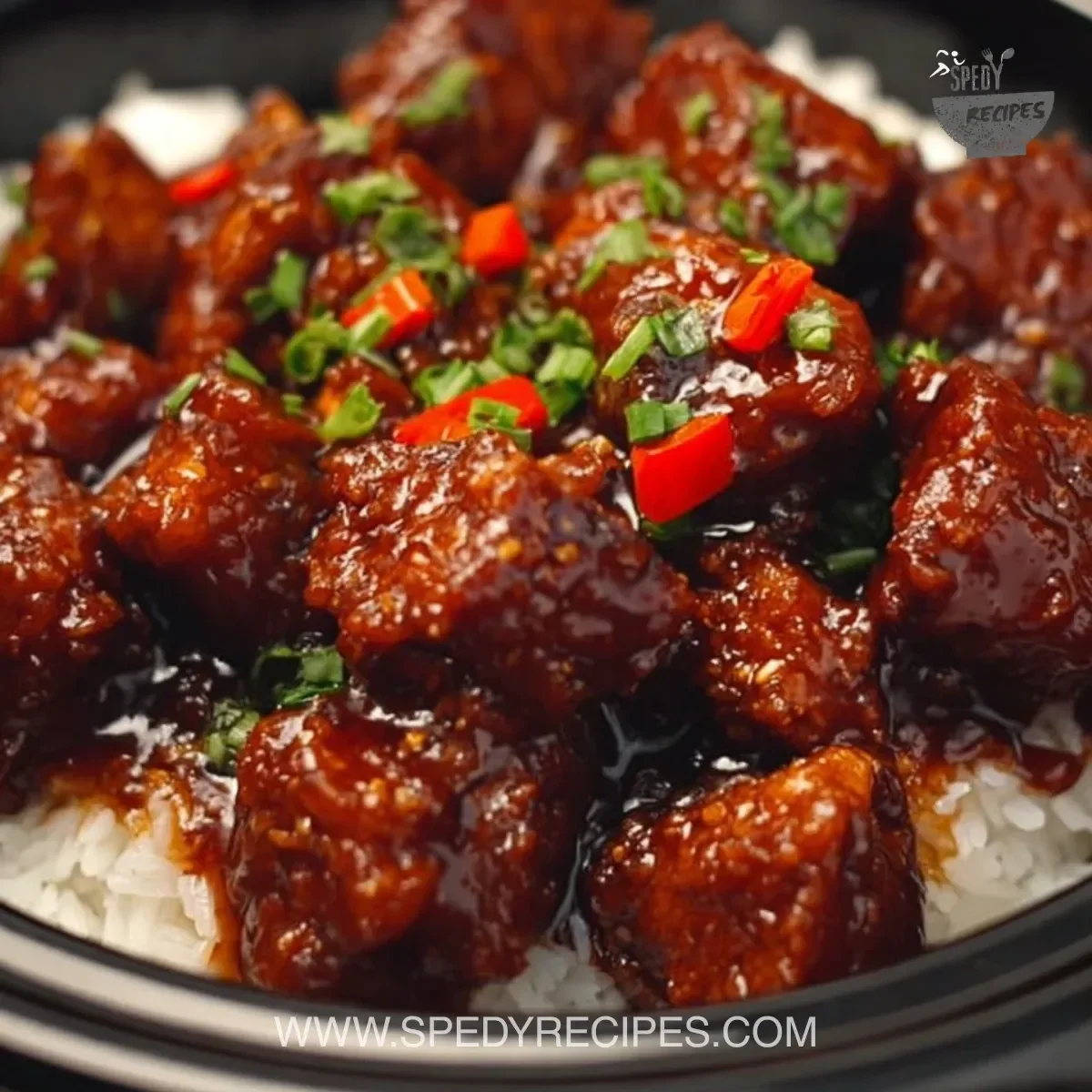 Easy Crockpot General Tso's Chicken served with rice and vegetables.