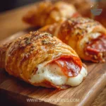 Mozzarella pepperoni croissant rolls served on a plate