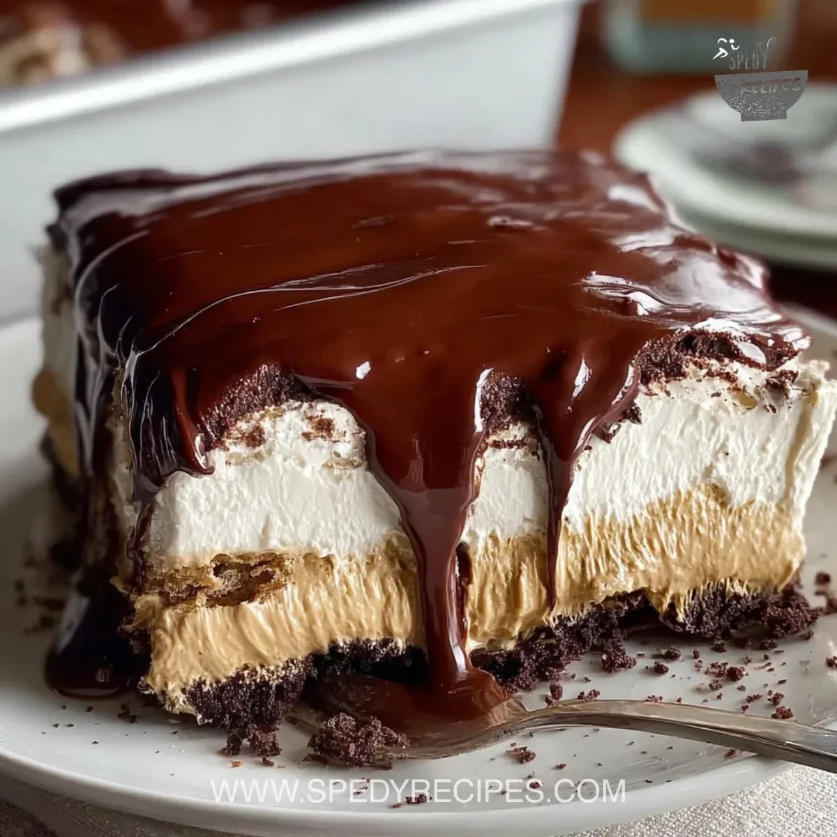No-bake chocolate eclair cake with layers of cream and chocolate topping