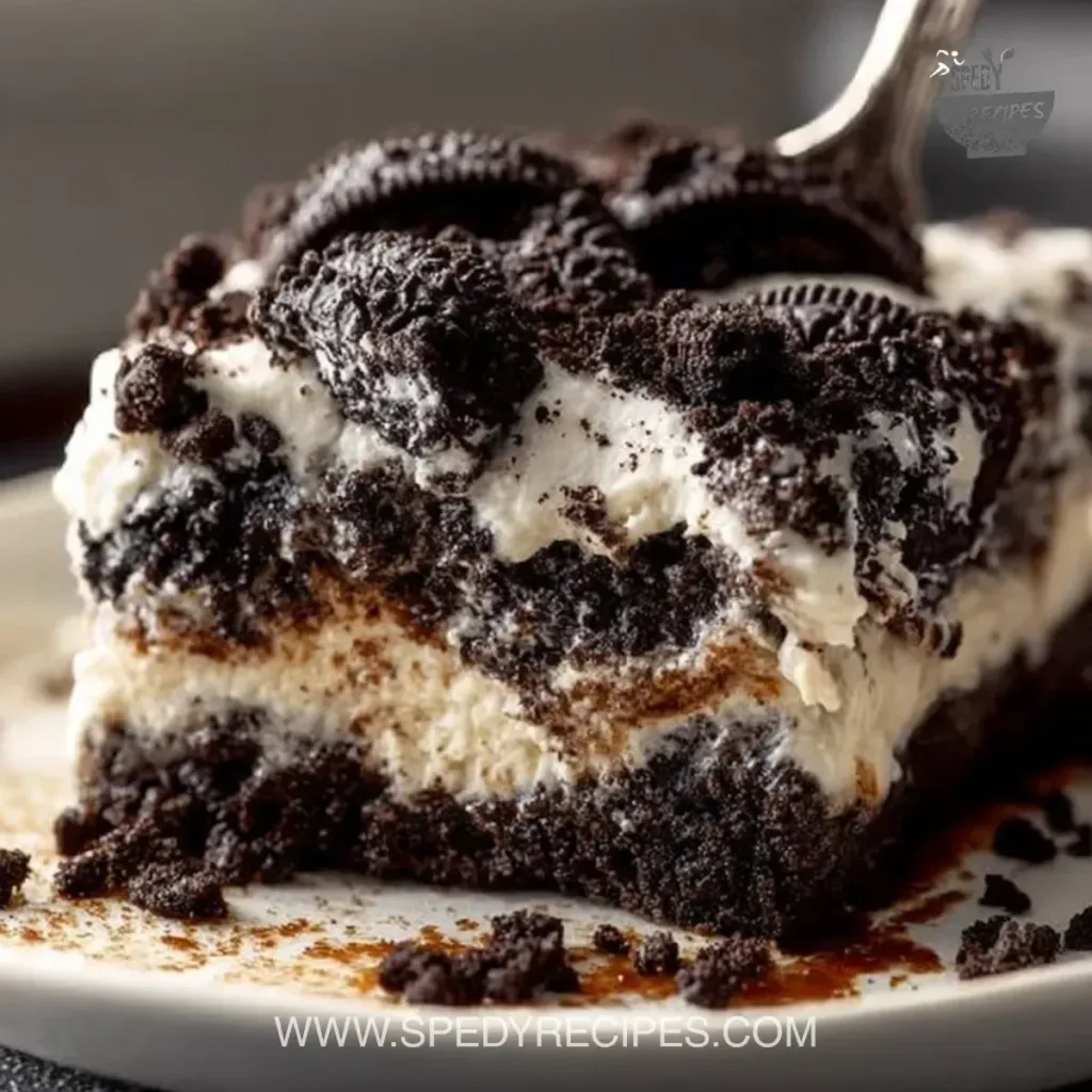 Oreo Dump Cake Delicious Oreo Dump Cake with creamy layers and crushed Oreos on top