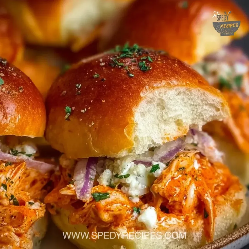 Spicy Buffalo Chicken Sliders Plate of spicy Buffalo Chicken Sliders with garnishes