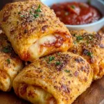 Air fryer pizza rolls ready to eat, golden brown and crispy.