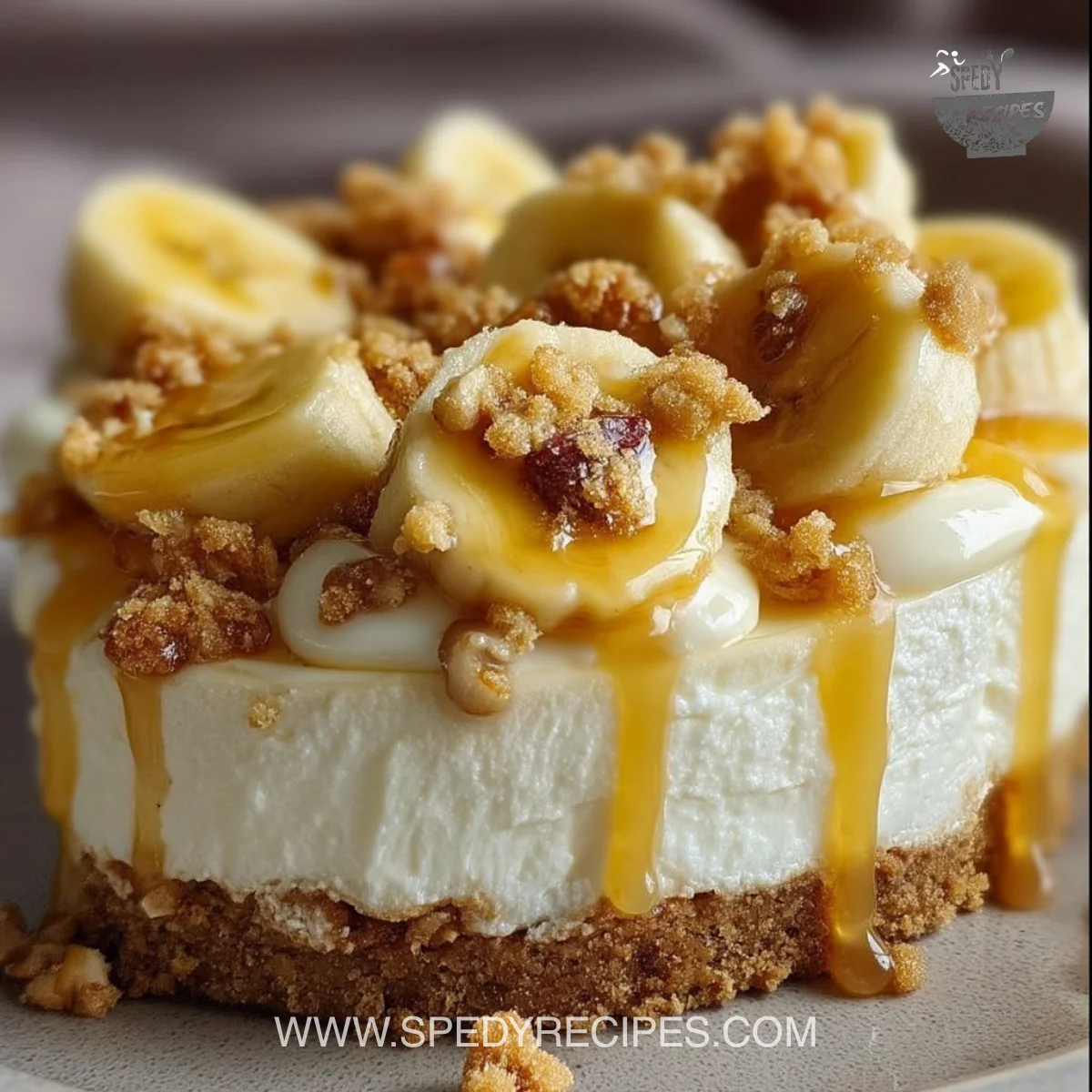 Delicious banana pudding crunch cheesecake topped with whipped cream and banana slices