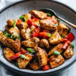 Plate of Easy Black Pepper Chicken garnished with vegetables