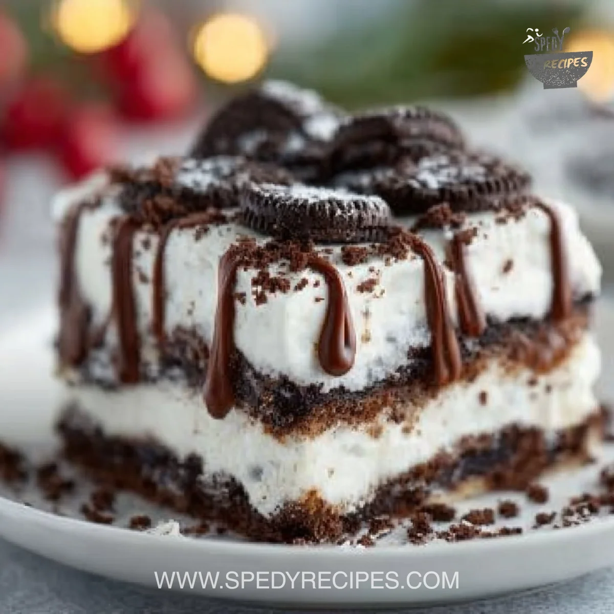 No Bake Christmas Oreo Lasagna with layers of cream and crushed Oreos