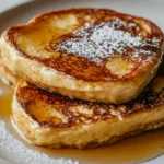 Delicious Blackstone French Toast served with syrup and berries