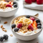 Cottage cheese breakfast bowl topped with fruits and nuts for a healthy meal