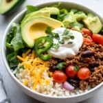 Low carb burrito bowl with eggs, veggies, and toppings for a healthy breakfast