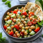 Colorful Mediterranean Chickpea Salad with tomatoes, cucumbers, and olives