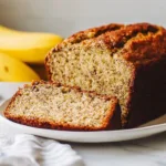 Deliciously baked Banana Quick Bread loaf on a wooden table