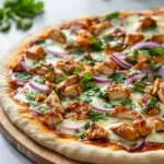 Delicious BBQ Chicken Pizza topped with BBQ sauce, grilled chicken, and cheese