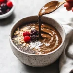 Delicious brownie batter overnight oats topped with chocolate and nuts.
