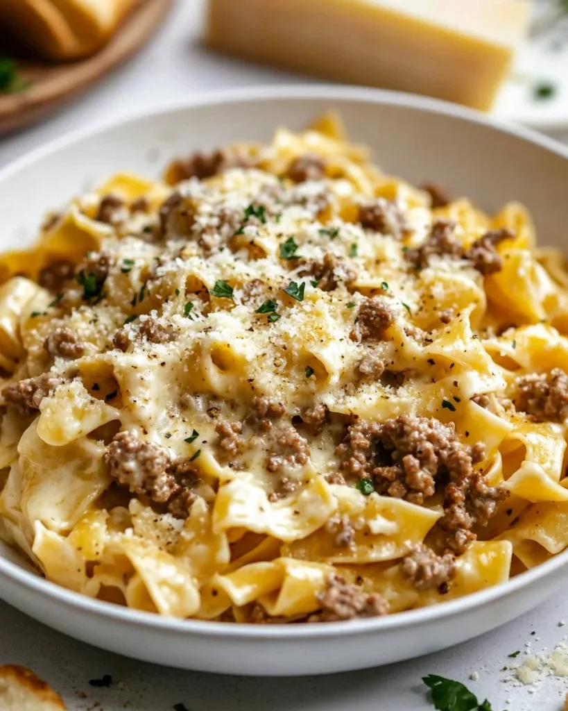 Creamy Cheese Pasta with Ground Beef Creamy cheese pasta dish with ground beef served in a bowl