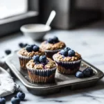 Hearty blueberry protein muffins fresh out of the oven, nutritious and delicious.