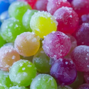 Colorful Kool-Aid Grapes served in a bowl, a fun and tasty snack.