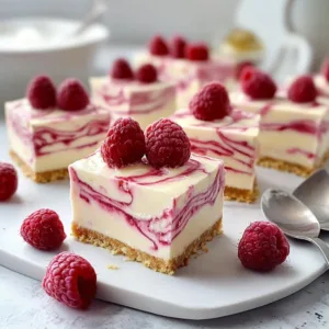 Delicious no-bake raspberry cheesecakes topped with fresh raspberries