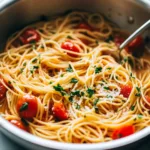 Delicious One Pot Pasta served in a bowl garnished with fresh herbs