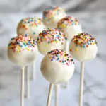 Starbucks cake pop in a colorful wrapper ready to be enjoyed.