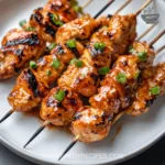 Delicious Bang Bang Chicken skewers served with dipping sauce