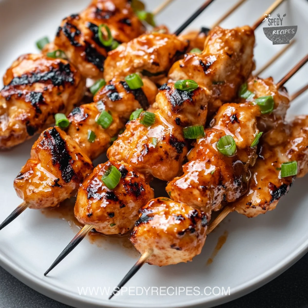 Delicious Bang Bang Chicken skewers served with dipping sauce