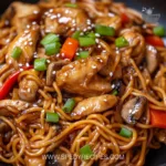 Plate of Blackstone Chicken Lo Mein with vegetables and chicken