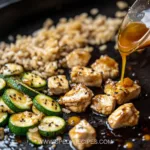 Grilled hibachi chicken on a Blackstone griddle with vegetables and sauce