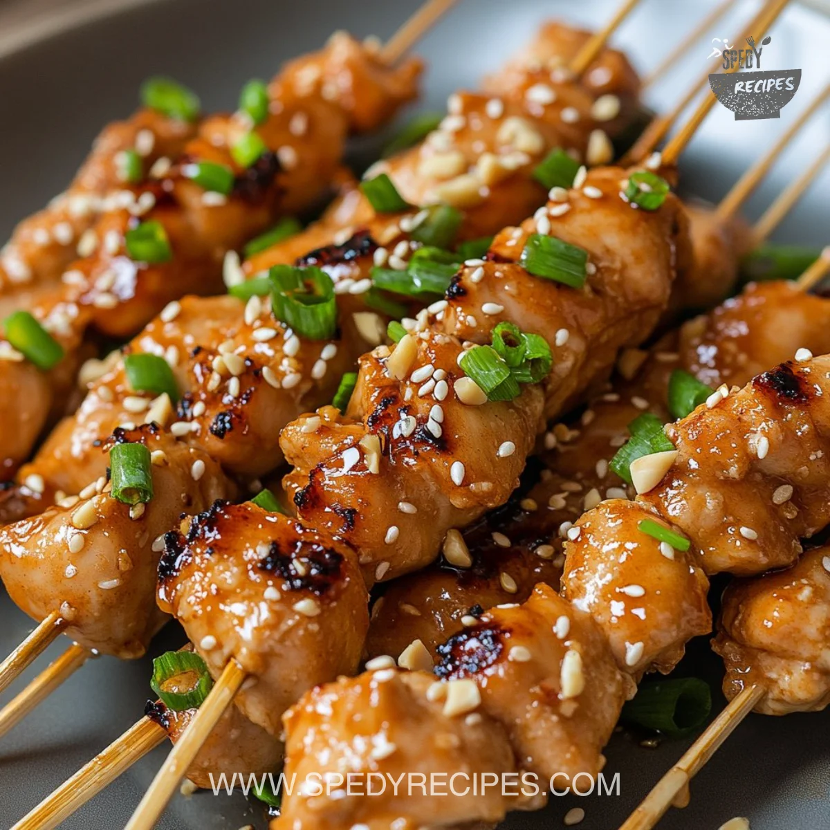 Delicious classic Bang Bang Chicken skewers served with dipping sauce