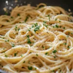 Plate of Garlic Lemon Parmesan Pasta topped with fresh herbs