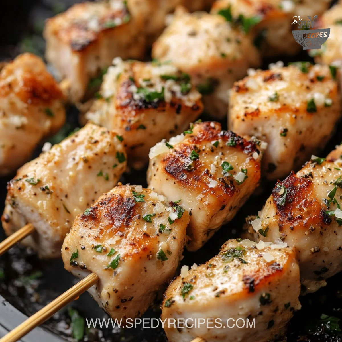 Delicious Garlic Parmesan Chicken Skewers served on a plate.