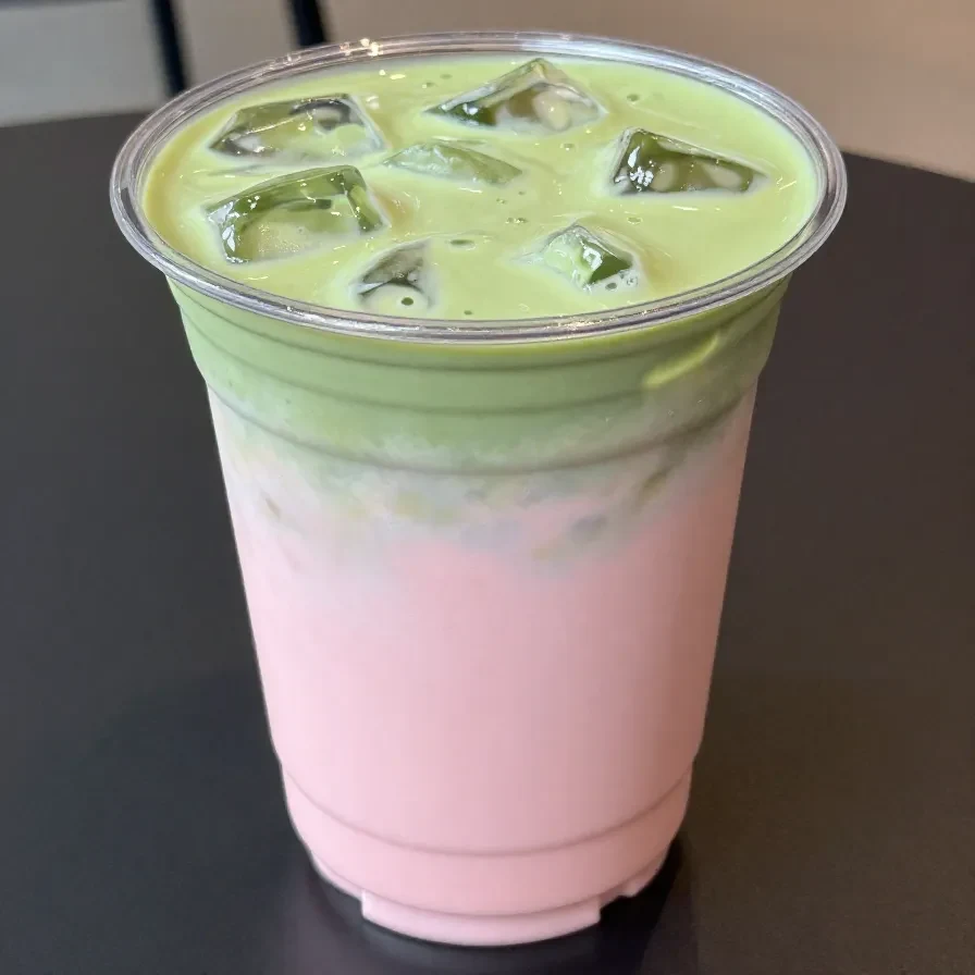 A TikTok-inspired Starbucks Matcha Pink Drink in a clear cup with ice.