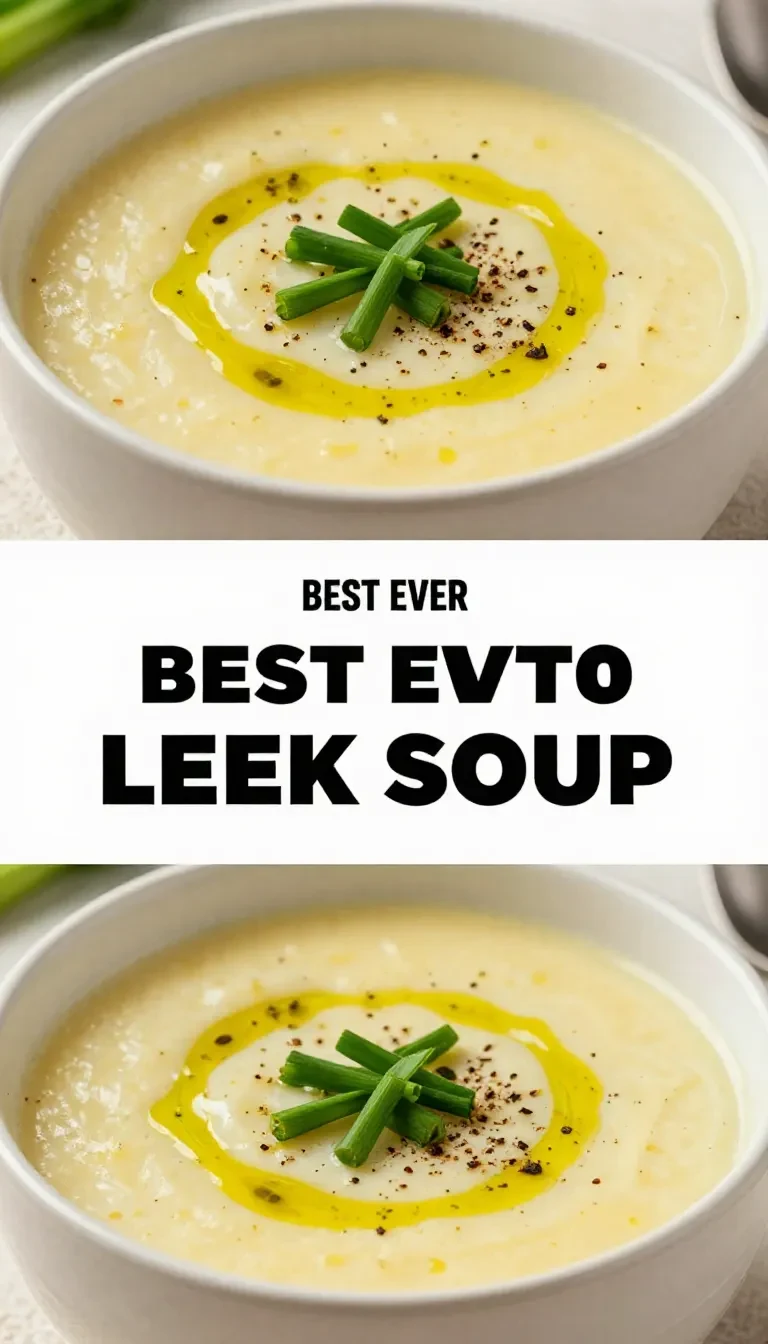 A bowl of creamy potato leek soup garnished with fresh herbs, served on a rustic wooden table.