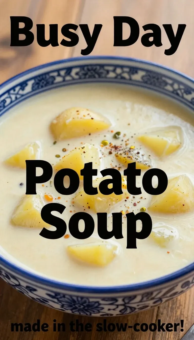 A bowl of creamy crockpot potato soup garnished with fresh rosemary and thyme.